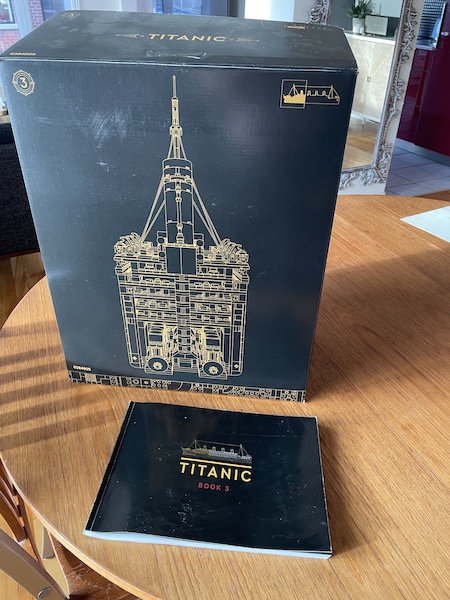 Example of the inner boxes of the Titanic LEGO set and a manual. This is box three of three Example of the inner boxes of the Titanic LEGO set and a manual. This is box three of three