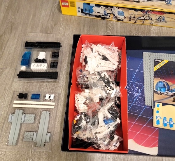 LEGO 6990 Space Futuron Monorail Transport System from 1978 open box. Click to sell or appraise yours