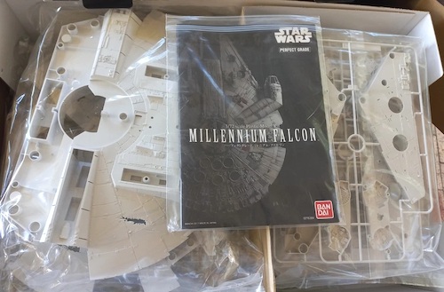 Bandai Perfect Grade Star Wars Millennium Falcon Model Kit open box. Click to value or sell one today